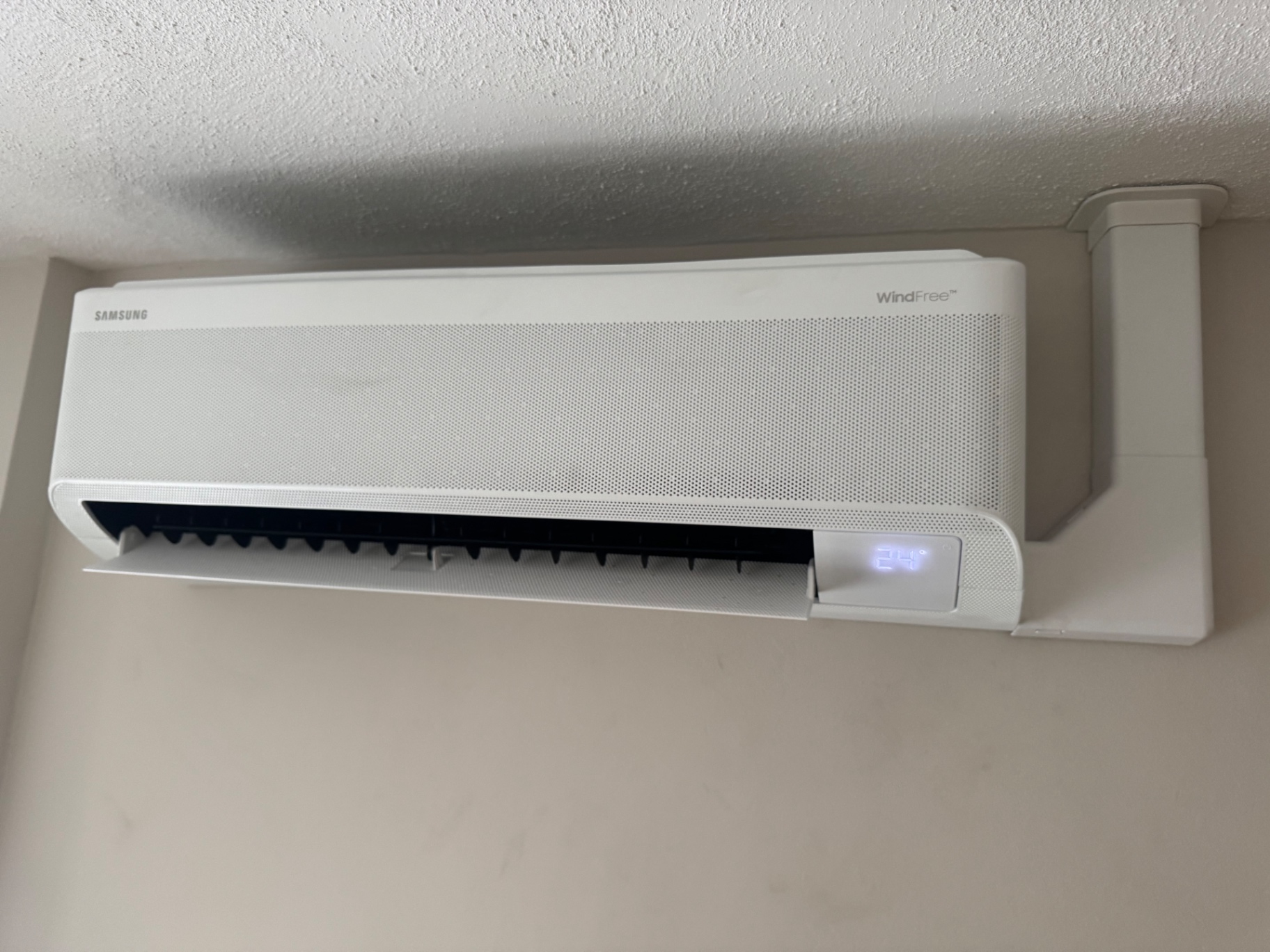 Samsung WindFree wall-mounted air conditioning unit with white trunking